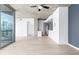 Open living area with hardwood floors, and balcony access showcasing city views and modern interior finishes at 3324 Peachtree Ne Rd # 2518, Atlanta, GA 30326