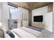Comfortable main bedroom with concrete ceiling, city view, and modern furniture at 3324 Peachtree Ne Rd # 2518, Atlanta, GA 30326