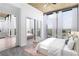 Bright main bedroom featuring floor-to-ceiling windows and walk-in closet with mirrored doors at 3324 Peachtree Ne Rd # 2518, Atlanta, GA 30326