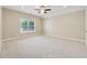 Spacious bedroom featuring plush carpet, ample natural light, and a serene atmosphere at 430 La Perla Dr, Sugar Hill, GA 30518