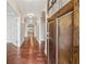 Inviting hallway with hardwood floors and arched doorways at 430 La Perla Dr, Sugar Hill, GA 30518