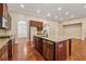 Kitchen island with granite countertops and stainless steel dishwasher at 430 La Perla Dr, Sugar Hill, GA 30518