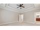 Bedroom with carpet, ceiling fan, trey ceiling, and doorway to bathroom at 430 La Perla Dr, Sugar Hill, GA 30518
