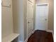 Mudroom with white wainscoting, a bench, and hooks for organizing coats and accessories at 430 La Perla Dr, Sugar Hill, GA 30518