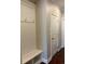 Mudroom features a built-in bench with hooks for storage at 430 La Perla Dr, Sugar Hill, GA 30518