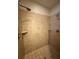 Shower with tile surround, corner shelves, and dual shower heads at 430 La Perla Dr, Sugar Hill, GA 30518