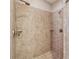 Shower with tile surround, corner shelves, and dual shower heads at 430 La Perla Dr, Sugar Hill, GA 30518