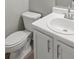 Clean bathroom featuring a white toilet and a sink with bright chrome fixtures at 5667 Cascade Sw Run, Atlanta, GA 30336