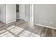 Bright bedroom showcasing hardwood floors and natural light from nearby windows at 5667 Cascade Sw Run, Atlanta, GA 30336
