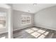 Bedroom with natural light, wood-look floors, and neutral paint at 5667 Cascade Sw Run, Atlanta, GA 30336