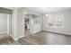 Bright dining area with open floor plan, hardwood floors, and views of the kitchen at 5667 Cascade Sw Run, Atlanta, GA 30336