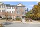 Attractive townhome featuring brick exterior, manicured landscaping, and a welcoming entryway at 5667 Cascade Sw Run, Atlanta, GA 30336