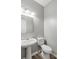 Neutral half bathroom with pedestal sink and modern toilet at 5667 Cascade Sw Run, Atlanta, GA 30336