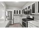 Updated kitchen featuring stainless steel appliances, gas range and modern cabinets at 5667 Cascade Sw Run, Atlanta, GA 30336