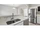 Modern kitchen featuring stainless appliances, sink with faucet, and lots of counter space at 5667 Cascade Sw Run, Atlanta, GA 30336