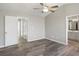 Spacious bedroom with fan, walk-in closets, and ensuite bathroom at 5667 Cascade Sw Run, Atlanta, GA 30336