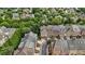 Aerial view of townhome exteriors and community amenities surrounded by beautiful landscaping at 2291 Falmouth Se Ct # 23, Smyrna, GA 30080