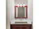 Modern bathroom featuring marble countertops, undermount sink and wood cabinetry at 2291 Falmouth Se Ct # 23, Smyrna, GA 30080