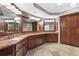 Luxurious bathroom featuring a long vanity with granite countertop and wood cabinets at 2291 Falmouth Se Ct # 23, Smyrna, GA 30080
