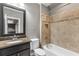 Full bathroom features a granite vanity and a tiled shower and tub at 2291 Falmouth Se Ct # 23, Smyrna, GA 30080