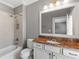 Bathroom featuring granite countertop, bathtub with shower, and vanity providing a functional space at 2291 Falmouth Se Ct # 23, Smyrna, GA 30080