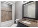 Bathroom with granite vanity, tiled shower, and neutral wall color at 2291 Falmouth Se Ct # 23, Smyrna, GA 30080