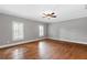 Spacious bedroom with hardwood floors, neutral walls and a ceiling fan at 2291 Falmouth Se Ct # 23, Smyrna, GA 30080