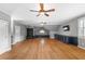 Spacious bonus room with hardwood floors, built-in storage, and ceiling fans for comfort at 2291 Falmouth Se Ct # 23, Smyrna, GA 30080