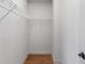 Small closet with wood flooring featuring basic shelving for easy organization at 2291 Falmouth Se Ct # 23, Smyrna, GA 30080