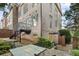 Elegant brick exterior of a multi-story home with a patio, balcony and landscaped surroundings at 2291 Falmouth Se Ct # 23, Smyrna, GA 30080