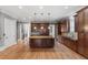 Gourmet kitchen with custom cabinets, granite countertops, and a large center island at 2291 Falmouth Se Ct # 23, Smyrna, GA 30080