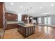 Expansive kitchen with granite counters, central island cooktop, and stainless steel appliances at 2291 Falmouth Se Ct # 23, Smyrna, GA 30080