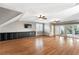 Large living room with hardwood floors, media center and access to outdoor terrace at 2291 Falmouth Se Ct # 23, Smyrna, GA 30080