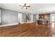 Open-concept living space with hardwood floors and a view into the kitchen at 2291 Falmouth Se Ct # 23, Smyrna, GA 30080
