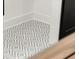 Modern geometric pattern tile in a bathroom of a renovated home at 2327 Mason Dr # D23, Atlanta, GA 30316