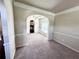 Inviting living room showcasing an open floor plan, with archways and views to the kitchen at 958 Nevis Way, Mcdonough, GA 30253