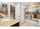 Bathroom featuring granite countertop vanity, shower with sliding glass door, and neutral toned wall paint at 1835 Redbourne Dr, Atlanta, GA 30350