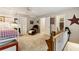 The bedroom includes a sitting area, carpet, natural light, and a small peek at the connecting bathroom at 1835 Redbourne Dr, Atlanta, GA 30350