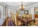 Elegant dining room with hardwood floors, large chandelier, and stylish decor at 1835 Redbourne Dr, Atlanta, GA 30350