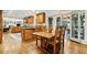 Open kitchen with dining area featuring a wooden table and access to the outdoor patio at 1835 Redbourne Dr, Atlanta, GA 30350