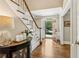 Elegant foyer with hardwood floors, staircase, and an open front door at 1835 Redbourne Dr, Atlanta, GA 30350