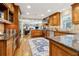 Large kitchen with stainless appliances, wood cabinets, and flows into the living room at 1835 Redbourne Dr, Atlanta, GA 30350