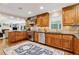 Well-appointed kitchen with stainless steel appliances, custom cabinetry, and a view to the living room at 1835 Redbourne Dr, Atlanta, GA 30350