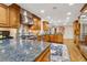 Gourmet kitchen featuring stainless steel appliances, custom cabinets, and island with granite countertop at 1835 Redbourne Dr, Atlanta, GA 30350
