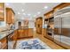 Spacious kitchen with stainless steel appliances, custom cabinetry, and granite countertops at 1835 Redbourne Dr, Atlanta, GA 30350