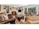 Cozy living room with brick fireplace, built-in shelving, and comfortable seating at 1835 Redbourne Dr, Atlanta, GA 30350