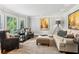 Bright and inviting living room with bay window, hardwood floors, and comfortable seating at 1835 Redbourne Dr, Atlanta, GA 30350