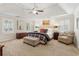 Spacious main bedroom features tray ceiling, plush carpeting, and seating area for relaxation at 1835 Redbourne Dr, Atlanta, GA 30350
