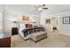 Serene main bedroom boasts tray ceiling, soft colors, and an ensuite bathroom entrance at 1835 Redbourne Dr, Atlanta, GA 30350