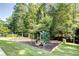 Community playground with swings, slides, and play structures in a park-like setting at 1835 Redbourne Dr, Atlanta, GA 30350